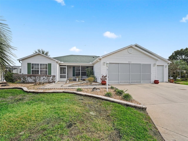 ranch-style house with a front lawn and a garage