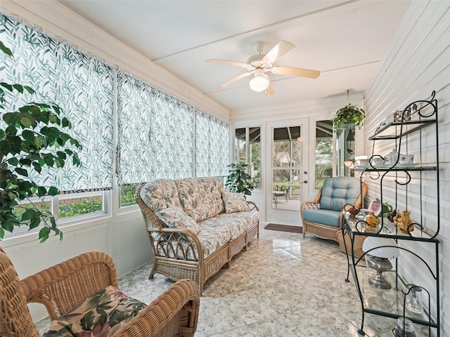 sunroom with ceiling fan