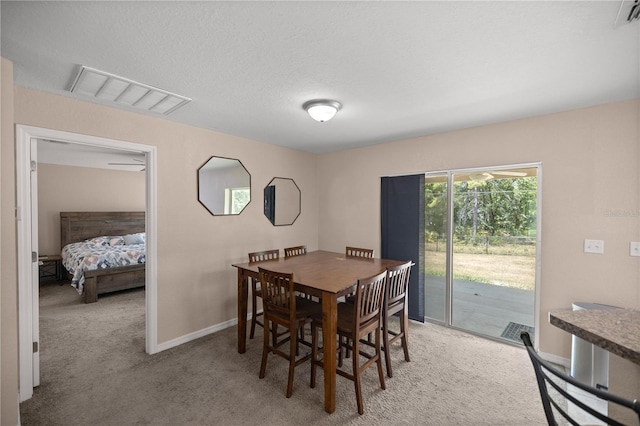 view of carpeted dining area