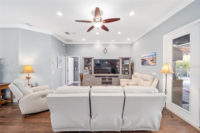 living room featuring ceiling fan, wood-type flooring, and crown molding