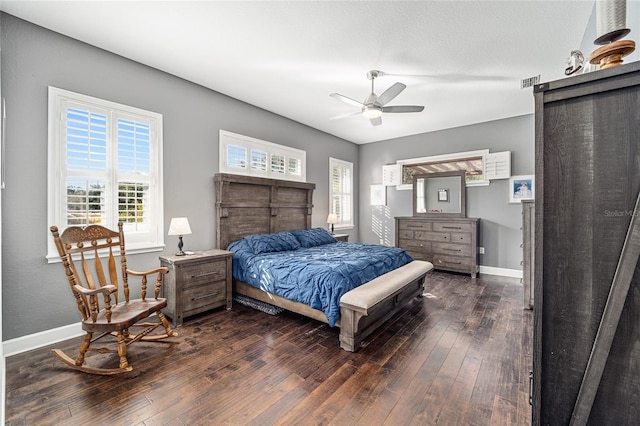 bedroom with ceiling fan and dark hardwood / wood-style flooring