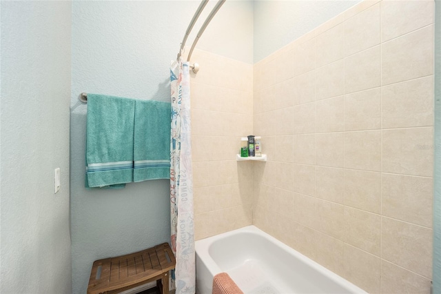 bathroom with shower / bathtub combination with curtain