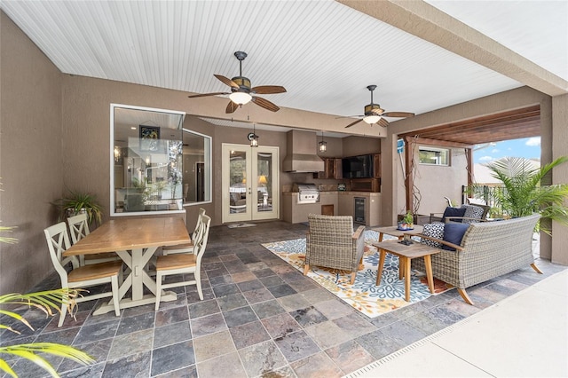 view of patio / terrace with ceiling fan, french doors, wine cooler, and a grill