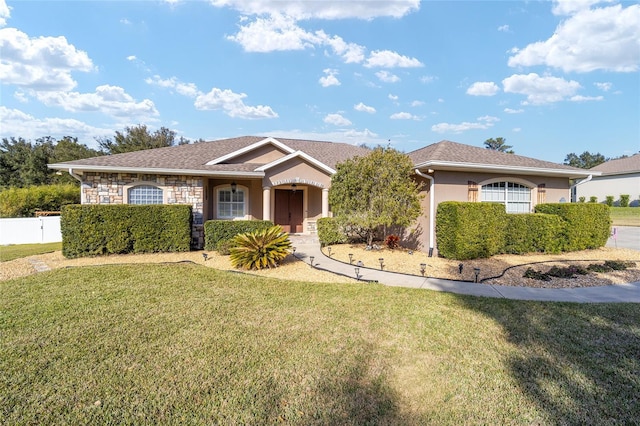 ranch-style house featuring a front lawn