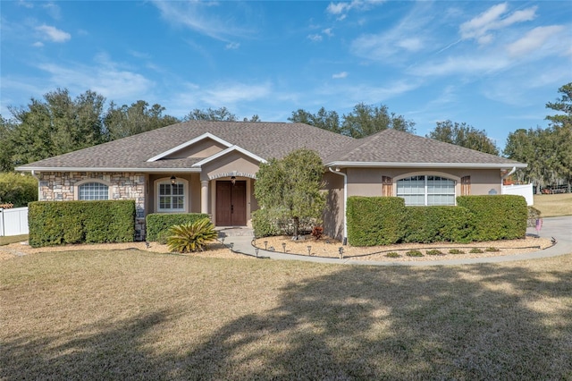 ranch-style house featuring a front yard