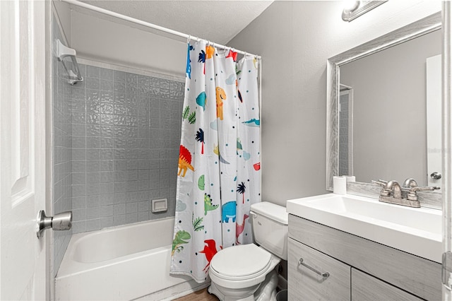 full bathroom featuring a textured ceiling, vanity, shower / tub combo, and toilet