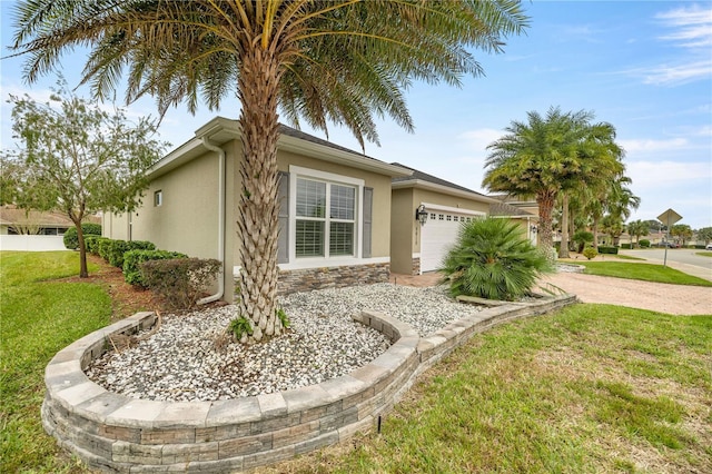 view of property exterior featuring a garage and a lawn