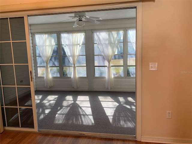 interior space featuring ceiling fan, a healthy amount of sunlight, and hardwood / wood-style flooring