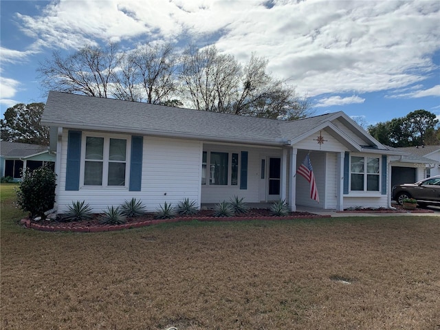 ranch-style home with a front lawn