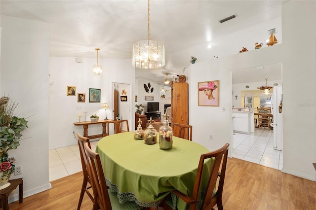 tiled dining room featuring ceiling fan