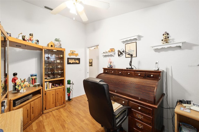 home office with ceiling fan and light wood-type flooring