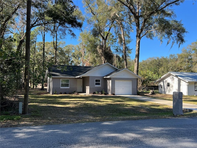 ranch-style home with a front lawn and a garage