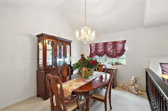 carpeted dining room featuring an inviting chandelier and vaulted ceiling