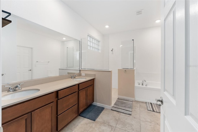 bathroom featuring tile patterned flooring, vanity, and independent shower and bath