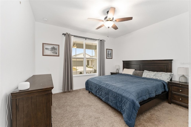 bedroom featuring ceiling fan and light carpet