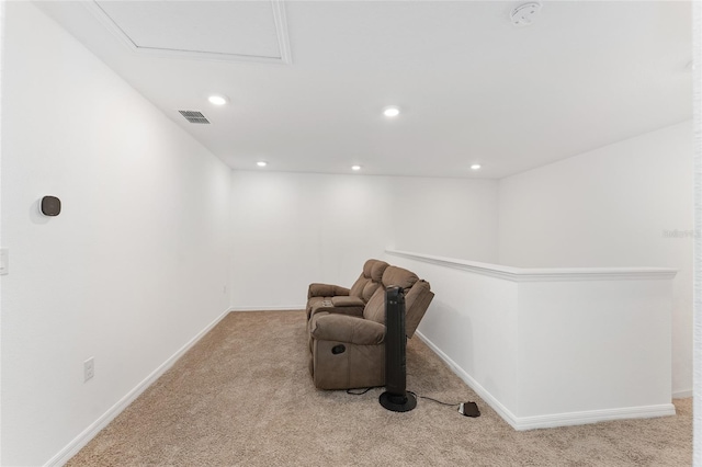 sitting room featuring light colored carpet