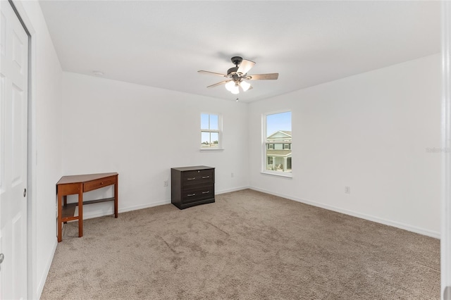 empty room with light carpet and ceiling fan