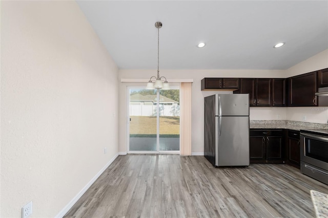 kitchen with light wood-style flooring, dark brown cabinets, baseboards, and appliances with stainless steel finishes