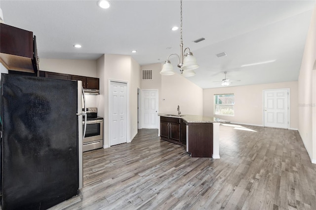 kitchen featuring visible vents, open floor plan, appliances with stainless steel finishes, light wood finished floors, and dark brown cabinets