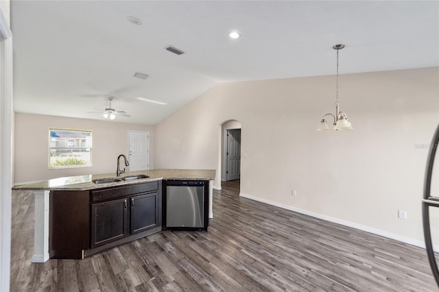 kitchen with visible vents, a sink, wood finished floors, dishwasher, and vaulted ceiling