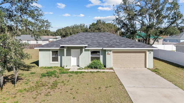 ranch-style home with a garage, concrete driveway, a front lawn, and fence