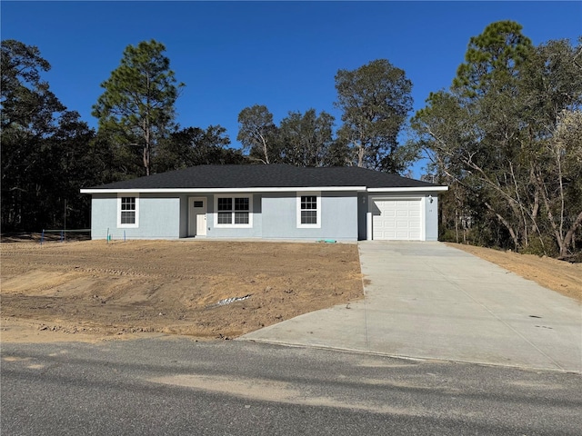 ranch-style home featuring a garage