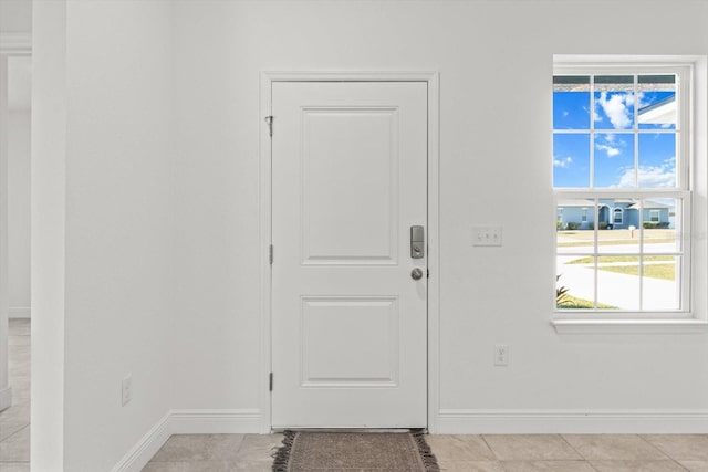 entryway featuring light tile patterned floors