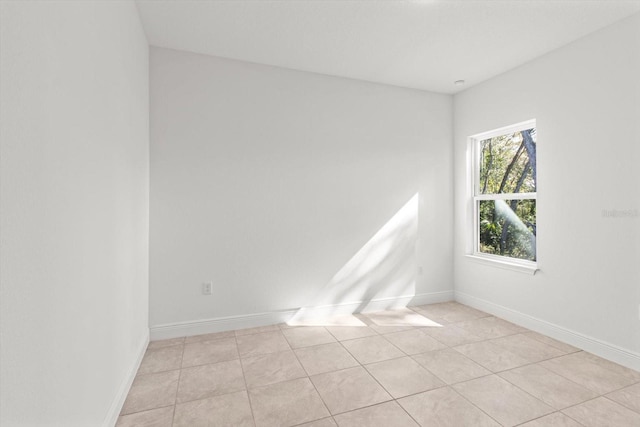 unfurnished room with light tile patterned floors