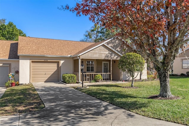 ranch-style home with a porch, a front yard, and a garage