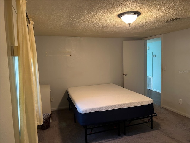 bedroom featuring a textured ceiling