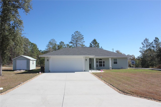 ranch-style home with a storage unit, a garage, and a front yard