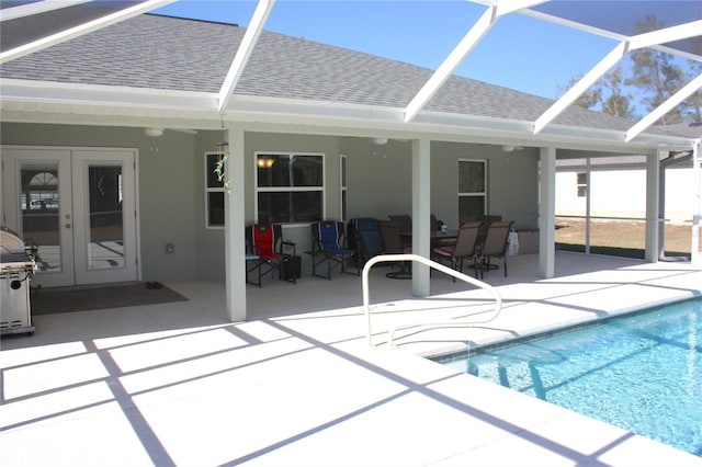 view of pool featuring a patio and french doors