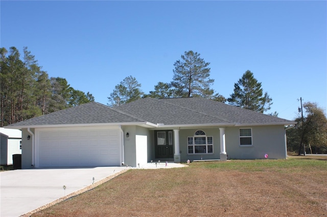 single story home with a front yard and a garage