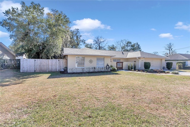 ranch-style house with a front lawn