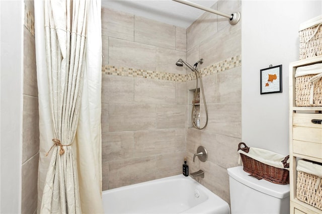 bathroom featuring toilet and shower / tub combo