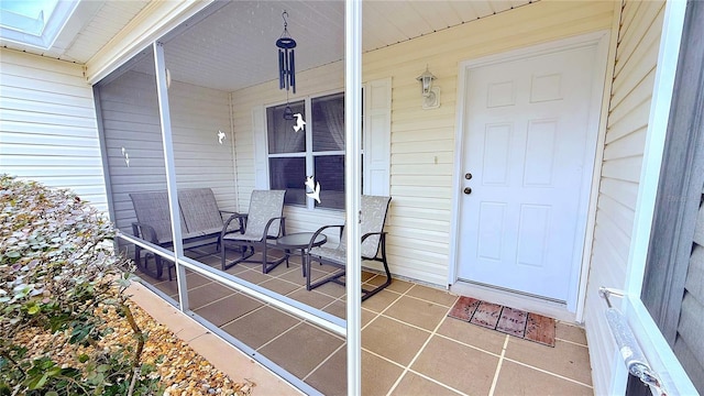 doorway to property with covered porch