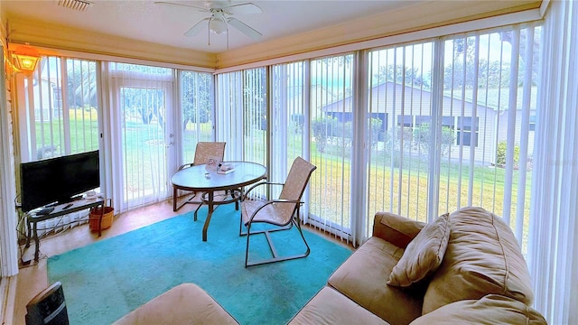 sunroom with ceiling fan and a wealth of natural light