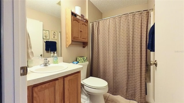 bathroom with toilet, a textured ceiling, and vanity