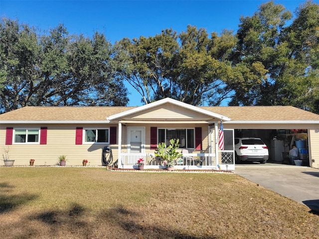 single story home with a porch, a garage, and a front lawn