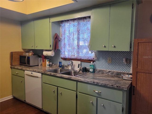 kitchen featuring green cabinets, sink, and white dishwasher