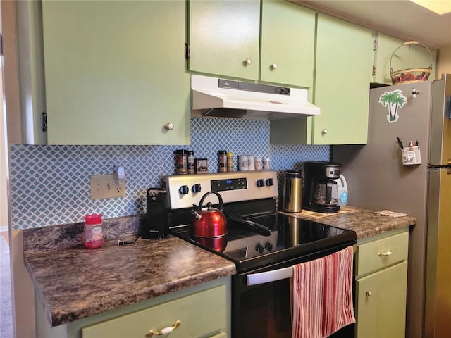 kitchen with decorative backsplash, stainless steel appliances, and green cabinetry