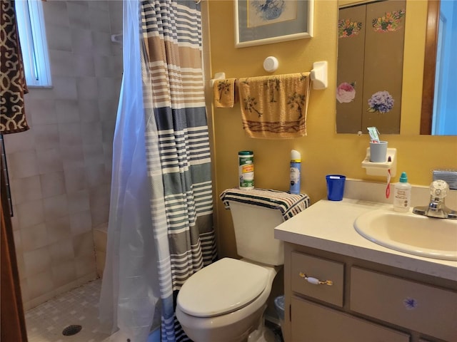 bathroom featuring toilet, vanity, and a shower with shower curtain