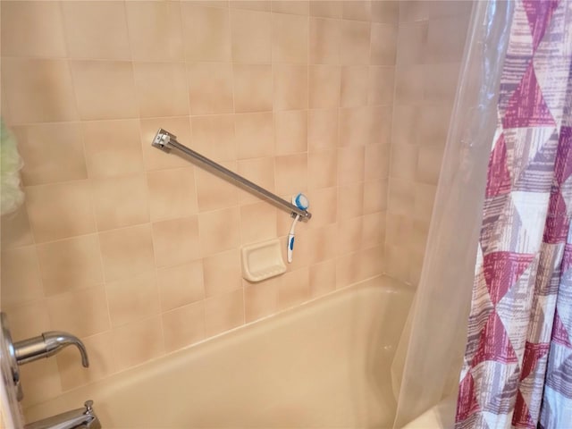 bathroom with shower / tub combo with curtain