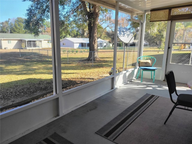 unfurnished sunroom featuring a wealth of natural light