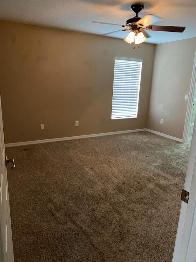 carpeted empty room with ceiling fan