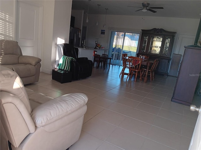 tiled living room with ceiling fan