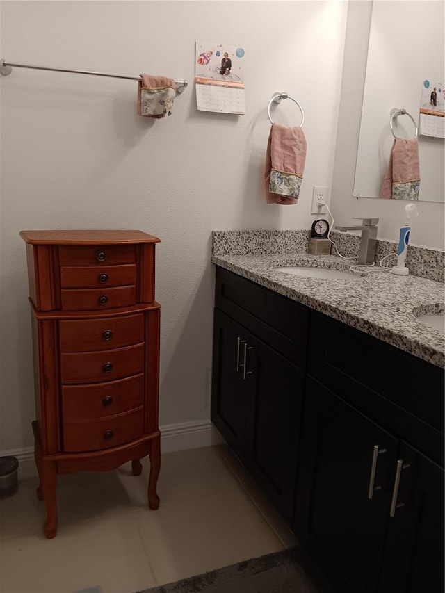 bathroom with tile patterned floors and vanity