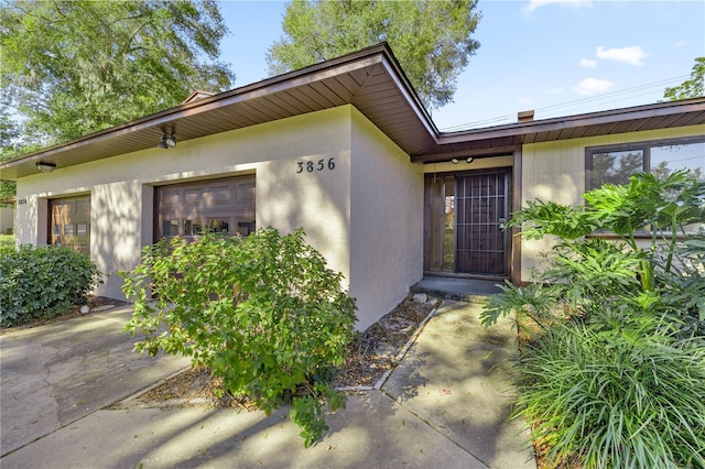 entrance to property featuring a garage