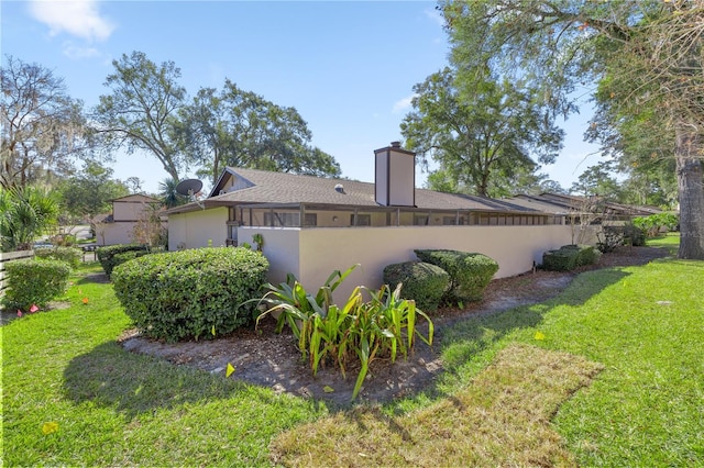 view of property exterior featuring a yard