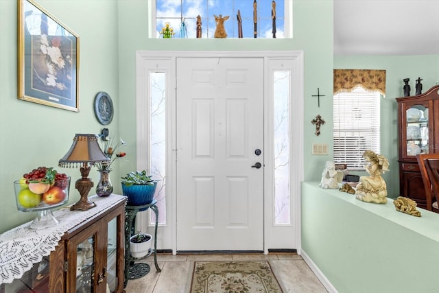 foyer featuring light tile patterned flooring